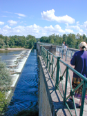 The walkway along the west side of this lock provides a view of the river passing over a weir.