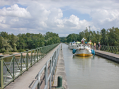 A northbound group of three boats awaits the signal to enter the lock.