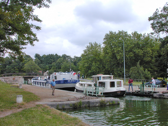 A converted fuel barge takes up most of the lock, but still enough room for a Locaboat penichette.
